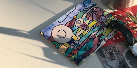 Event postcard and newsletter showcasing art events in morning sunlight with a shadow of a plant