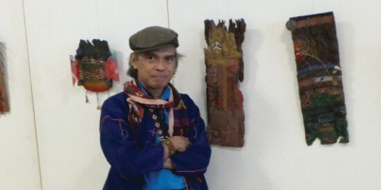 Artist William Gaudinez with his works on display